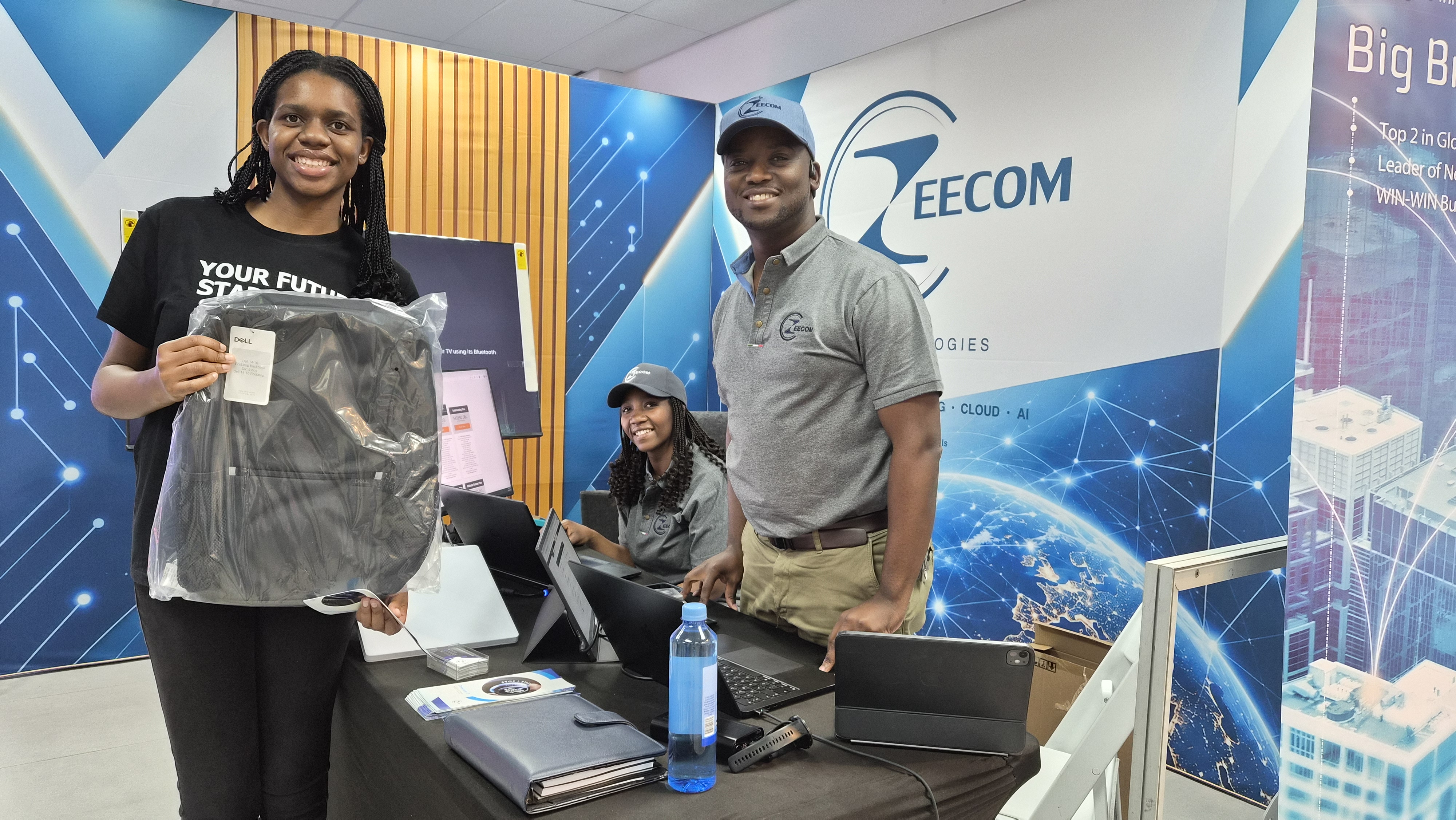 Visitors and Zeecom representatives at the exhibition stand