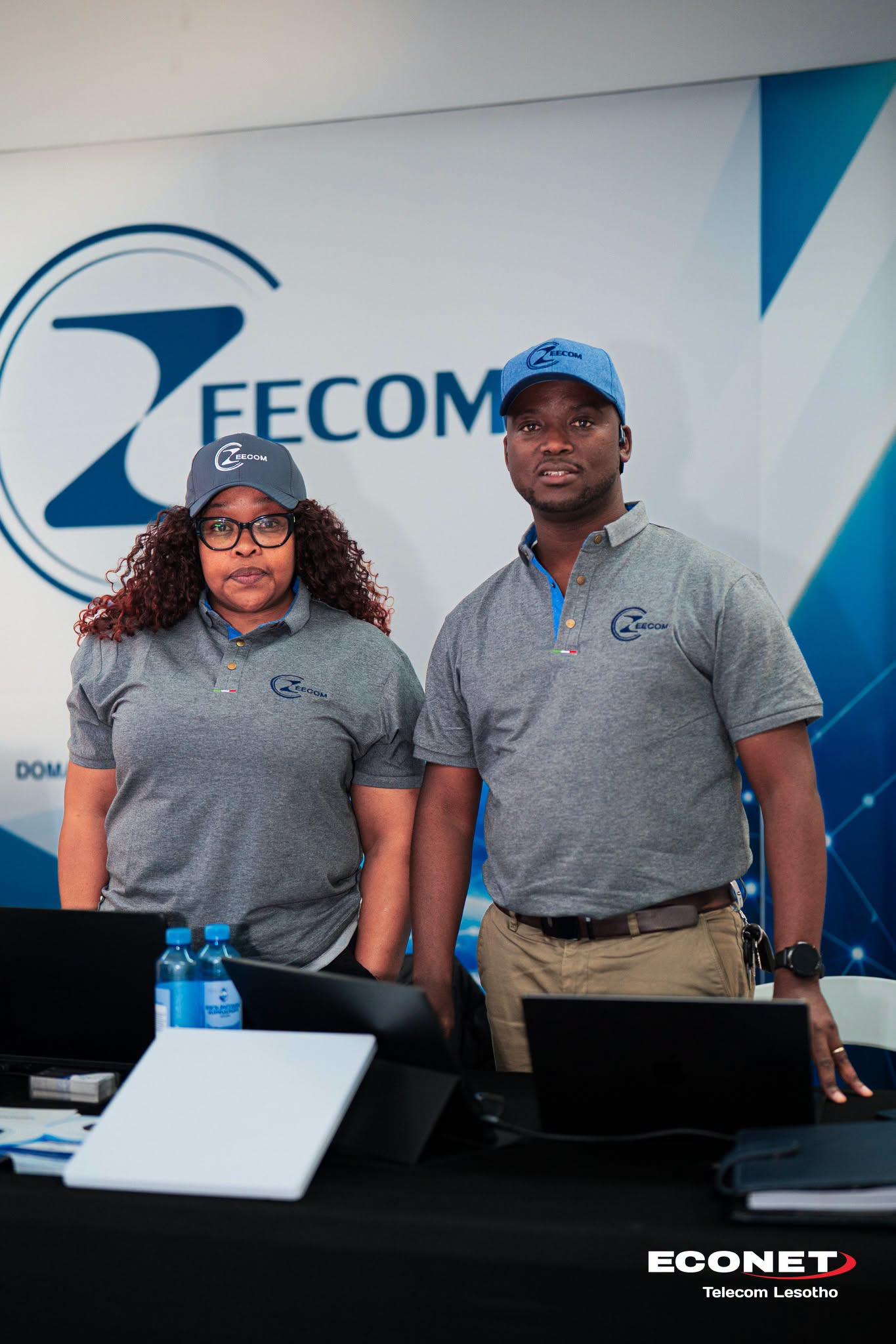 The Zeecom exhibition stand with the team demonstrating technology